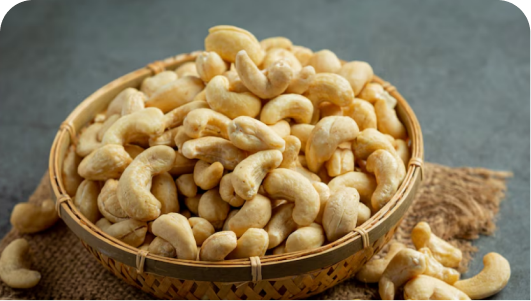 Shuddha Space raw jumbo cashew nuts showing a smooth, creamy texture and ivory color.